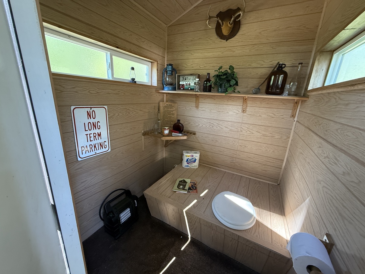 cute outhouse on remote lakefront property in alaska